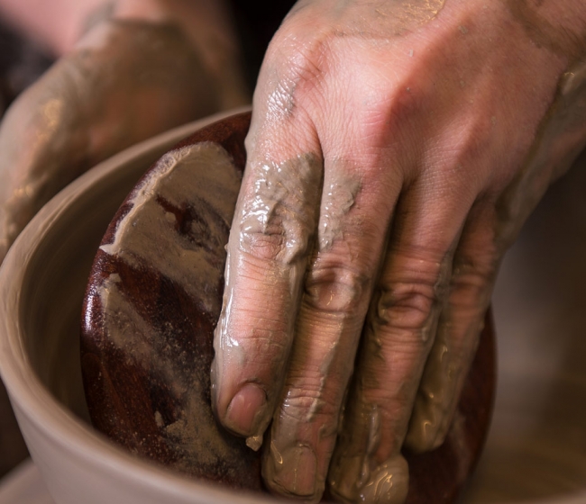 Picture of someone doing pottery